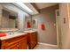 Well-lit bathroom featuring double vanity, updated fixtures, and neutral wall color at 131 Olde Mill Bay, Indianapolis, IN 46260