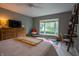 Cozy bedroom featuring bay window with water view, sitting area, and ample storage at 131 Olde Mill Bay, Indianapolis, IN 46260