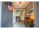 Bright foyer showcasing a console table and a view into the living area at 131 Olde Mill Bay, Indianapolis, IN 46260