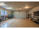 Spacious two-car garage with epoxy flooring and ample storage area at 131 Olde Mill Bay, Indianapolis, IN 46260