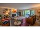 Spacious living room with a fireplace, stylish decor, and sliding doors to the outdoor space at 131 Olde Mill Bay, Indianapolis, IN 46260