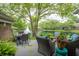 Beautiful outdoor patio overlooking a scenic pond with a fountain feature at 131 Olde Mill Bay, Indianapolis, IN 46260