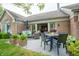 Relaxing outdoor patio space complete with comfortable seating and dining area at 131 Olde Mill Bay, Indianapolis, IN 46260