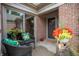 Cozy patio with comfortable seating, plants, and access to the interior at 131 Olde Mill Bay, Indianapolis, IN 46260
