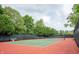 Outdoor tennis court surrounded by lush greenery, perfect for recreation and fitness at 131 Olde Mill Bay, Indianapolis, IN 46260
