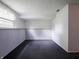 A finished section of basement with painted paneling and window at 1325 Countryside Ln, Indianapolis, IN 46231
