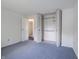 Bedroom with carpeted floors, closet and neutral walls at 1325 Countryside Ln, Indianapolis, IN 46231