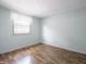 Bedroom with wood floors, curtains and neutral walls at 1325 Countryside Ln, Indianapolis, IN 46231