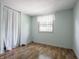 Bedroom featuring hardwood floors and natural lighting at 1325 Countryside Ln, Indianapolis, IN 46231