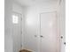 Bright hallway with white doors and neutral walls provides access to the rest of the home at 1325 Countryside Ln, Indianapolis, IN 46231