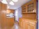 Cozy kitchen with granite countertops, wood cabinets, and modern appliances for meal preparation at 1325 Countryside Ln, Indianapolis, IN 46231