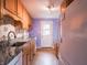 Bright and modern kitchen boasts granite counters and stainless steel appliances for easy cooking at 1325 Countryside Ln, Indianapolis, IN 46231