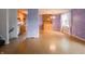 Spacious living room featuring hardwood floors, natural light, and adjacent eat-in kitchen at 1325 Countryside Ln, Indianapolis, IN 46231