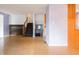 Inviting living room with wood flooring, stairs, and plenty of space for entertaining at 1325 Countryside Ln, Indianapolis, IN 46231