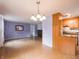 Cozy open-concept living room features wood flooring and seamless flow into the eat-in kitchen at 1325 Countryside Ln, Indianapolis, IN 46231