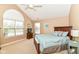 Relaxing bedroom with a vaulted ceiling, ceiling fan, and soft, neutral color palette at 13807 Rue Fontaine Ln, McCordsville, IN 46055