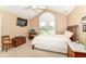 Bedroom features vaulted ceiling, neutral decor, a window, a television and furniture to provide comfort at 13807 Rue Fontaine Ln, McCordsville, IN 46055