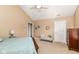 Bright bedroom with comfortable decor including bench and side tables at 13807 Rue Fontaine Ln, McCordsville, IN 46055