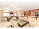 Open concept kitchen and dining area with modern lighting, island counter and view of the living room at 13807 Rue Fontaine Ln, McCordsville, IN 46055