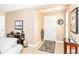 Welcoming entryway with neutral walls, tile floor and decorative rug, leading into the home's interior at 13807 Rue Fontaine Ln, McCordsville, IN 46055