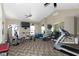 Exercise room featuring modern equipment and mirrored walls at 13807 Rue Fontaine Ln, McCordsville, IN 46055