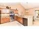 Charming kitchen features granite countertops, stainless steel appliances, and an eat-in bar at 13807 Rue Fontaine Ln, McCordsville, IN 46055
