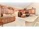 Well-appointed kitchen with custom cabinetry, granite countertops, and stainless steel appliances at 13807 Rue Fontaine Ln, McCordsville, IN 46055