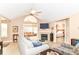 Comfortable living room with fireplace, vaulted ceiling, open layout to sun room and bedroom at 13807 Rue Fontaine Ln, McCordsville, IN 46055