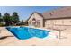 Sparkling outdoor swimming pool with sun loungers and a nearby community building at 13807 Rue Fontaine Ln, McCordsville, IN 46055