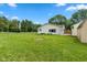 Exterior of home featuring an enclosed backyard with a well-maintained lawn and a chain-link fence at 1382 S Morgantown Rd, Greenwood, IN 46143