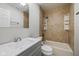 Modern bathroom showcasing a tiled shower and bathtub combo with an updated vanity at 1382 S Morgantown Rd, Greenwood, IN 46143