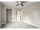 Bedroom featuring plush gray carpet, a ceiling fan, and an open closet with an entrance view at 1382 S Morgantown Rd, Greenwood, IN 46143