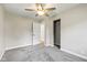 Bedroom featuring plush carpeting, open closet, and an open door to the en-suite bathroom at 1382 S Morgantown Rd, Greenwood, IN 46143
