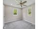 Cozy bedroom with soft carpet, natural light, neutral walls, and ample space for relaxation at 1382 S Morgantown Rd, Greenwood, IN 46143