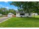 Charming single-story home with a well-maintained front yard, detached garage and ample green space at 1382 S Morgantown Rd, Greenwood, IN 46143