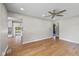 Inviting living room showcasing hardwood floors that flow into the connected kitchen at 1382 S Morgantown Rd, Greenwood, IN 46143