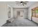 Bright sun room featuring carpeted floors, natural light and an opening to the kitchen at 1382 S Morgantown Rd, Greenwood, IN 46143