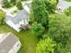 Aerial view of a home with a spacious backyard, deck, mature trees, and surrounding neighborhood at 13861 Barberry Ct, Carmel, IN 46033