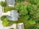 Aerial view of a well-maintained home with a gray roof, green yard, and mature trees in a residential neighborhood at 13861 Barberry Ct, Carmel, IN 46033