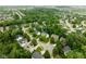 An aerial view of a charming neighborhood showcasing lush greenery and well-maintained homes in a suburban community at 13861 Barberry Ct, Carmel, IN 46033