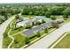 Aerial view of community amenities including a pool, clubhouse, tennis courts, playground, and parking lot at 13861 Barberry Ct, Carmel, IN 46033