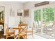 Charming breakfast nook with built-in seating and a sliding glass door to the outdoor deck at 13861 Barberry Ct, Carmel, IN 46033