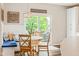 Cozy breakfast nook featuring built-in bench seating and access to the outdoor deck at 13861 Barberry Ct, Carmel, IN 46033