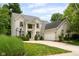 Stunning brick home with a well-maintained lawn, driveway, and attached garage, showcasing curb appeal at 13861 Barberry Ct, Carmel, IN 46033