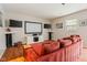 Basement home theater with comfortable seating and multiple screens for an immersive experience at 13861 Barberry Ct, Carmel, IN 46033