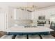 Contemporary kitchen featuring white cabinets, granite countertops, and stainless steel appliances at 13861 Barberry Ct, Carmel, IN 46033