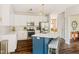 Modern kitchen featuring white cabinets, stainless steel appliances, and an island with seating at 13861 Barberry Ct, Carmel, IN 46033