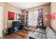 Relaxing living room with a gray sofa and colorful sports memorabilia for a unique design at 13861 Barberry Ct, Carmel, IN 46033