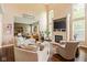 Bright and spacious living room with a fireplace, large windows, high ceilings, and modern furnishings at 13861 Barberry Ct, Carmel, IN 46033