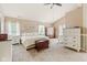 Spacious main bedroom featuring a vaulted ceiling, carpet, and ample natural light at 13861 Barberry Ct, Carmel, IN 46033